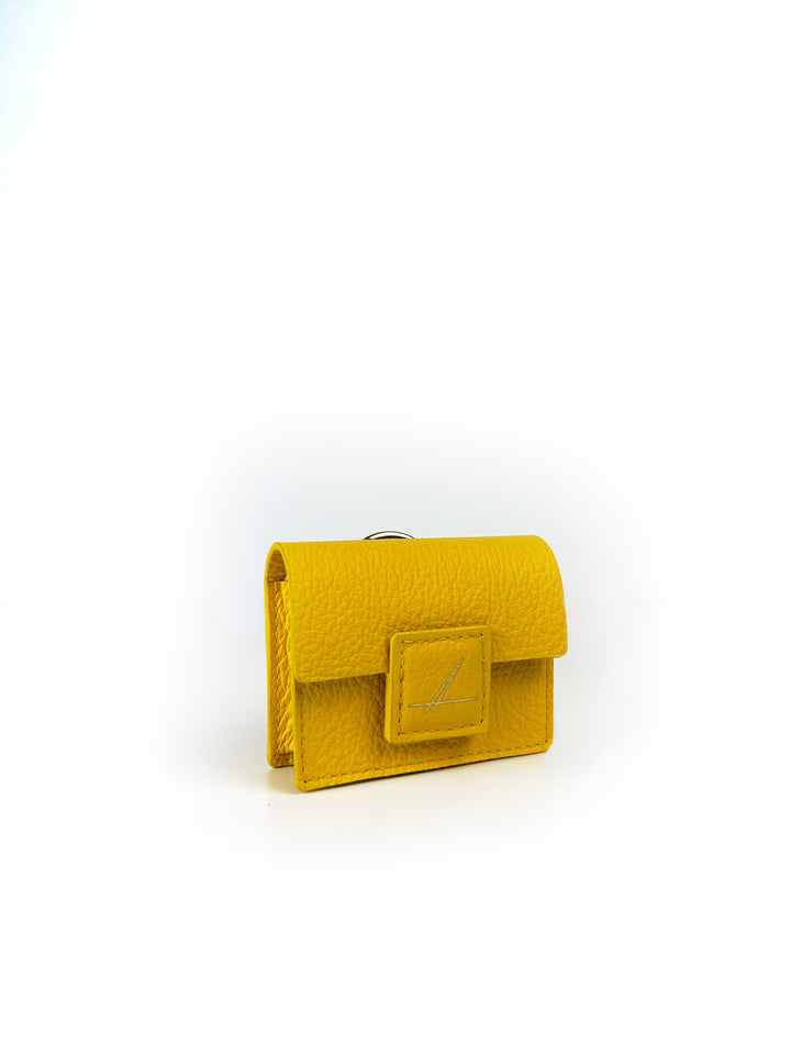 Yellow leather wallet with clasp on white background