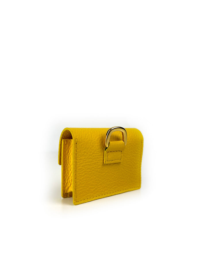 Yellow leather wallet with metal clasp on white background