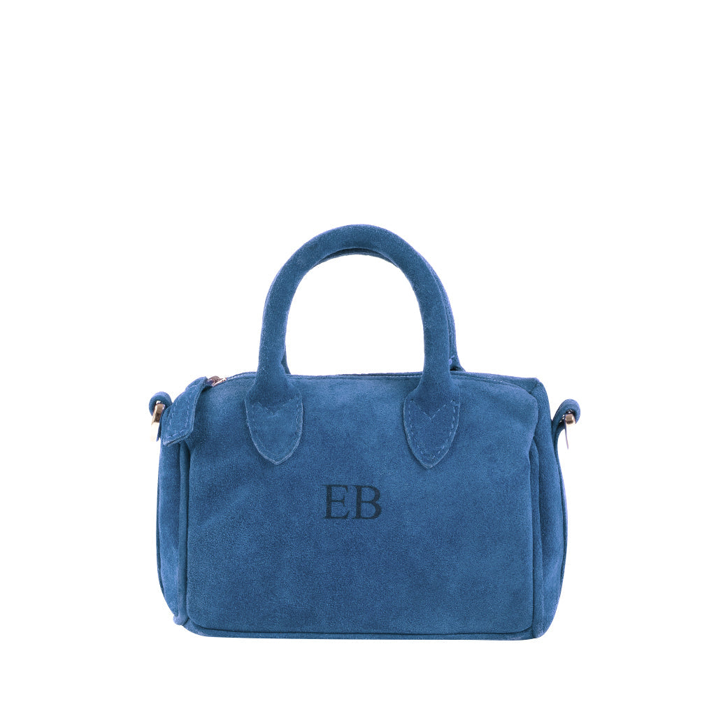 Elegant blue suede handbag with monogram initials embroidered on the front