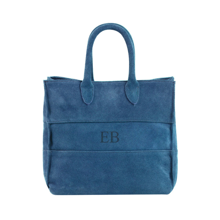 Blue suede tote bag with embossed EB initials in the center