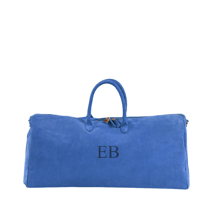Blue suede duffel bag with initials EB on the front