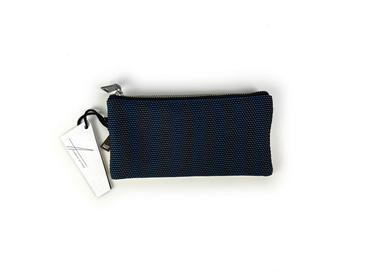 Black textured zippered pouch with white tag on a plain white background