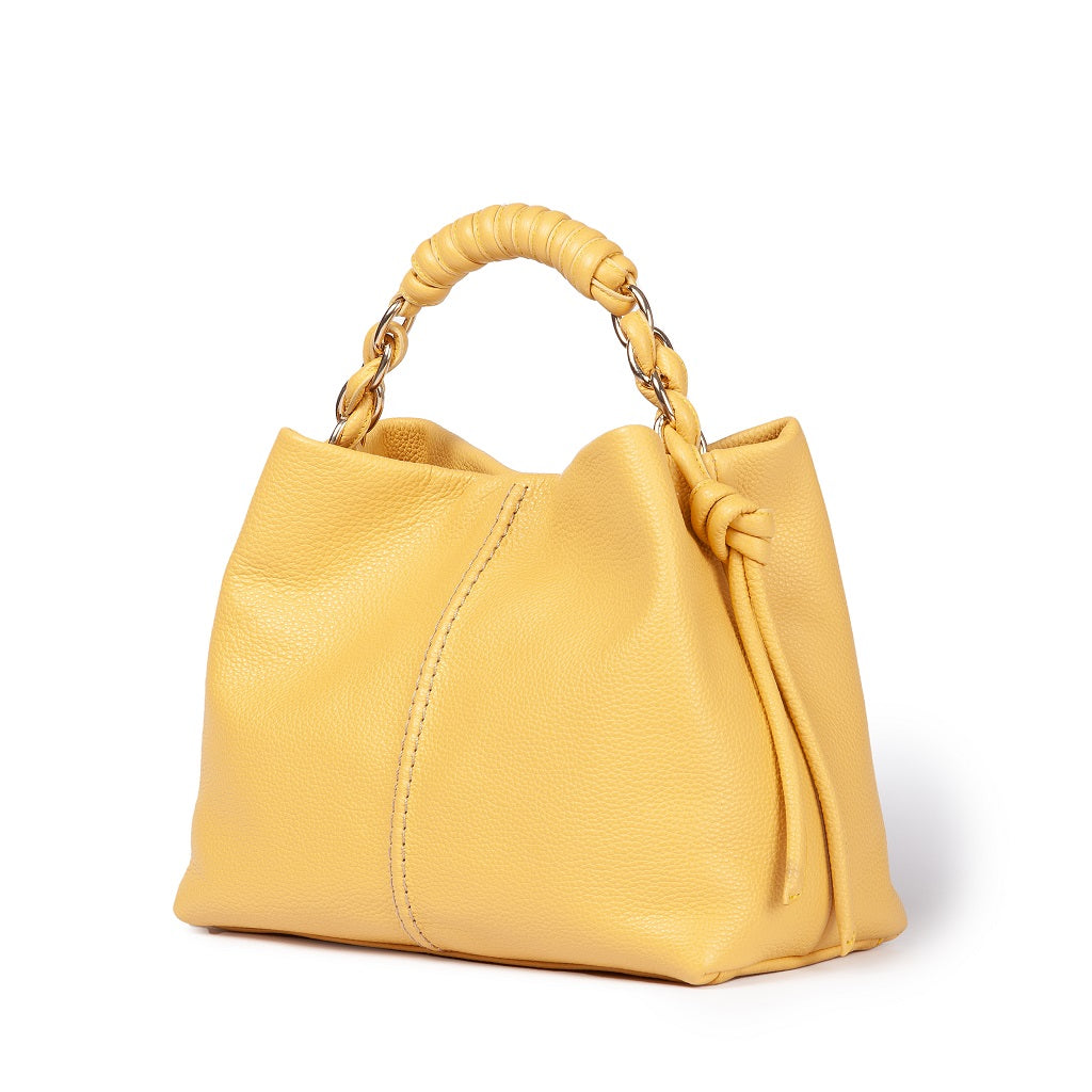 Yellow leather handbag with braided handle and gold chain accents