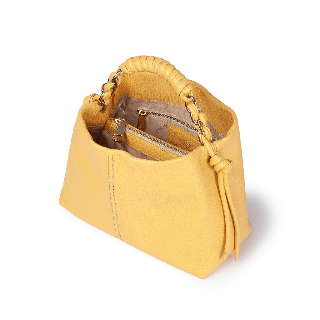 Yellow leather handbag with braided handle and visible interior pockets