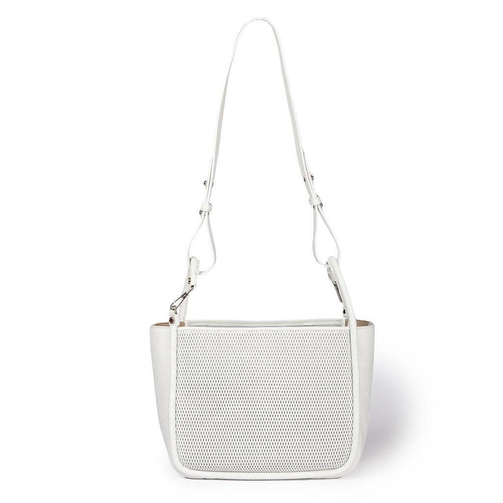 White leather handbag with adjustable shoulder strap and perforated front panel