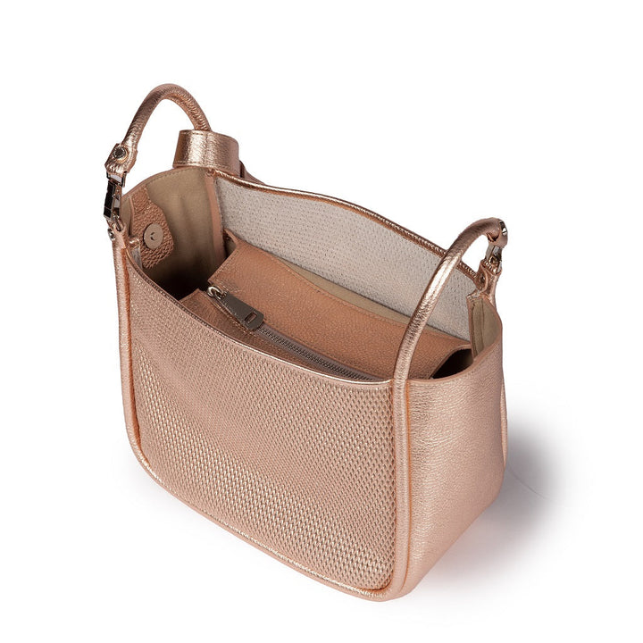 Rose gold leather handbag with open top showing interior compartments