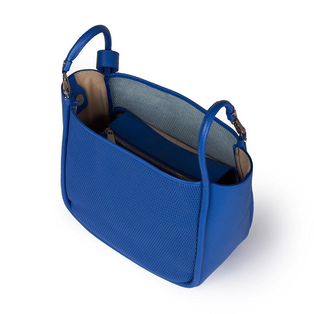 Blue leather handbag with open top and visible inner compartments