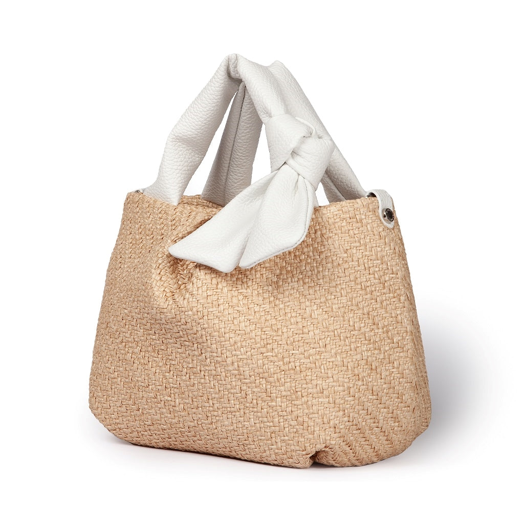 Beige woven handbag with white leather handles and a knot detail