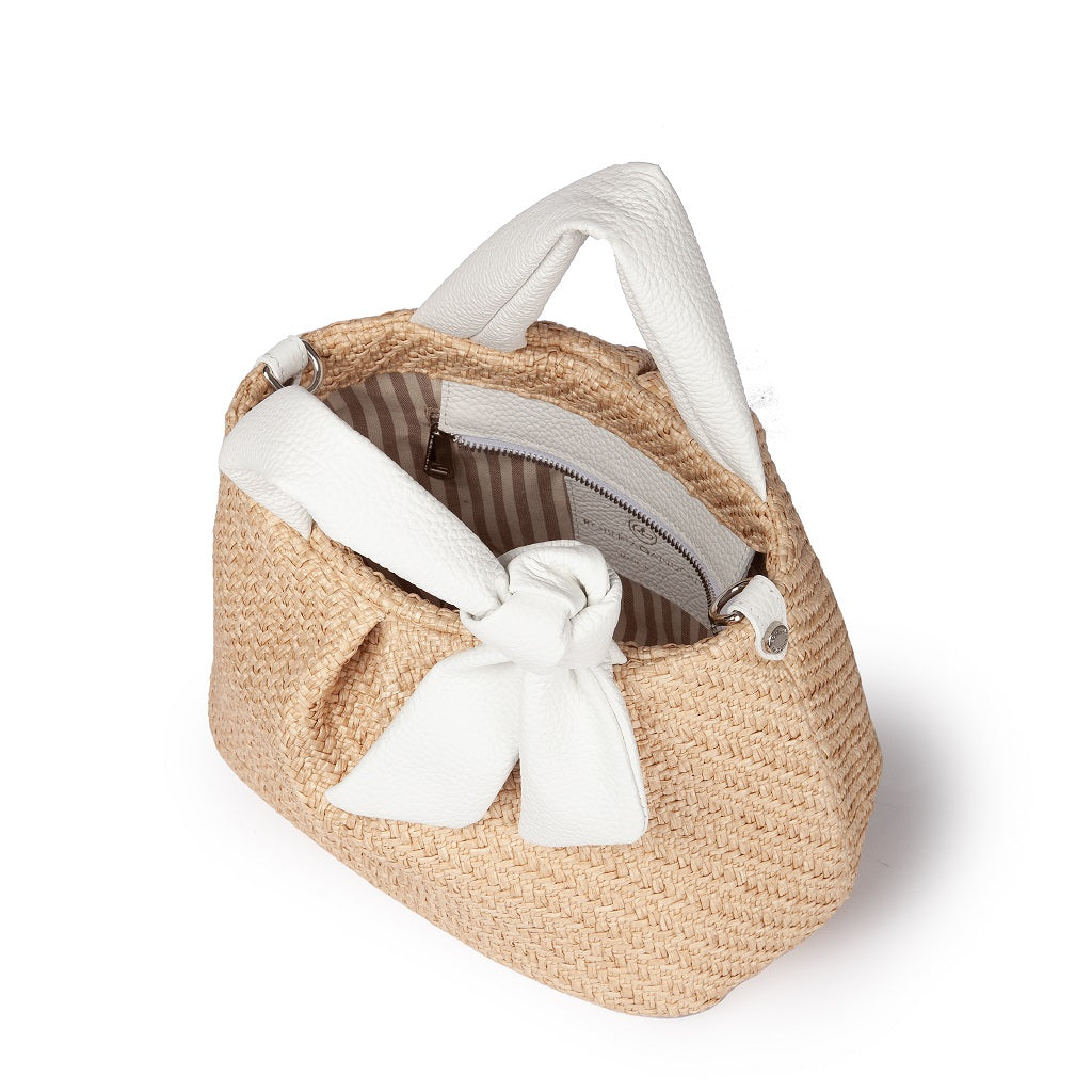 Straw handbag with white leather handles and bowtie detailing