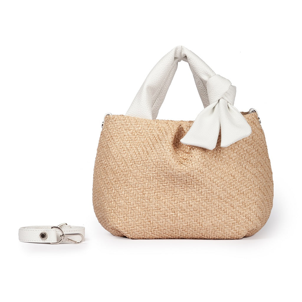 Stylish straw handbag with white bow and detachable strap