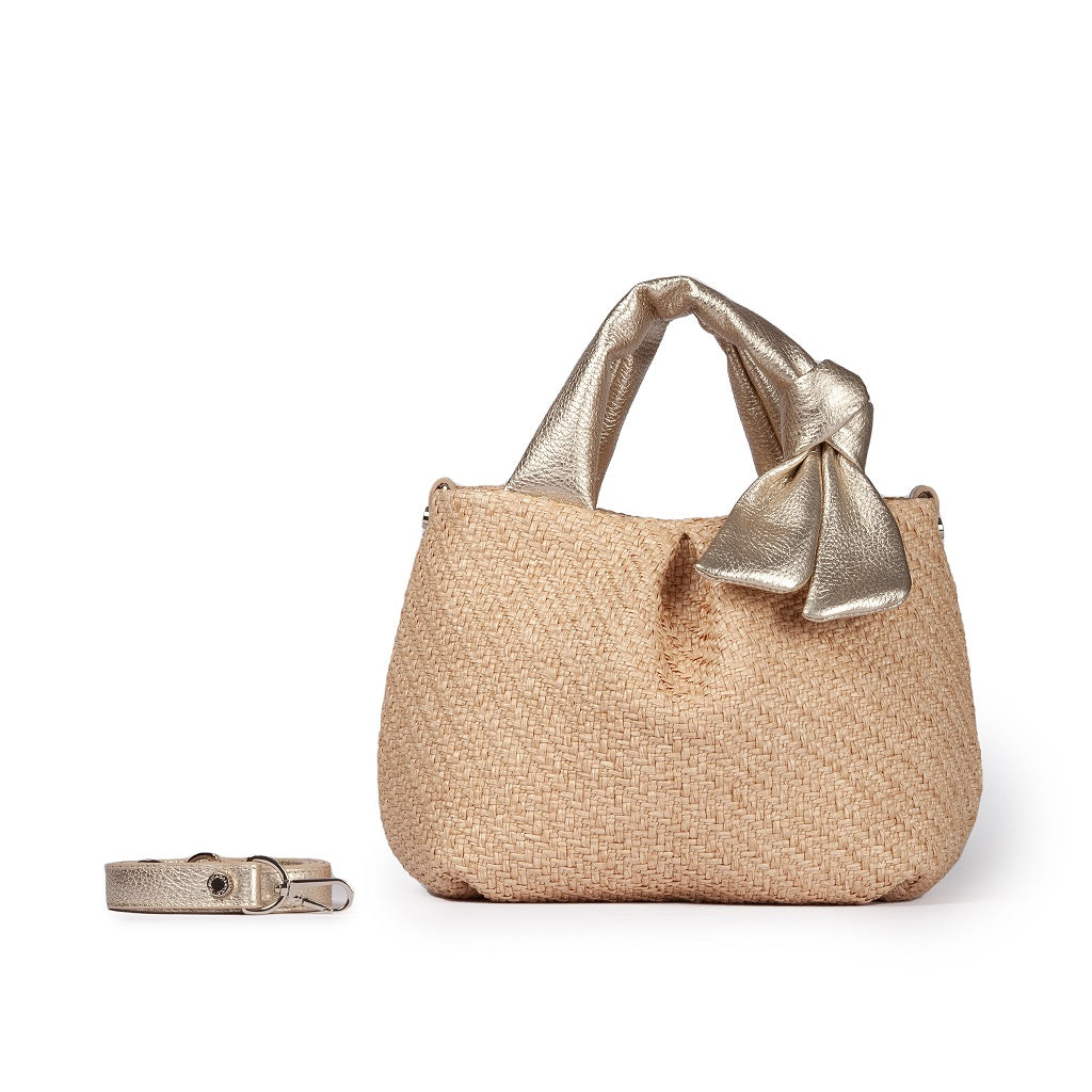 Beige woven handbag with gold bow detail and detachable strap