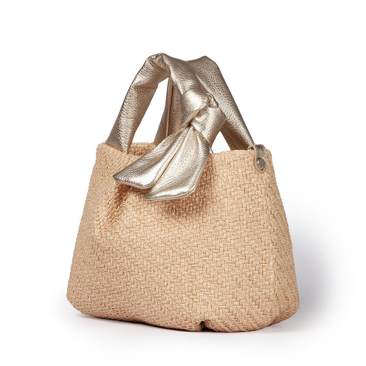 Beige woven tote bag with metallic gold handle bow