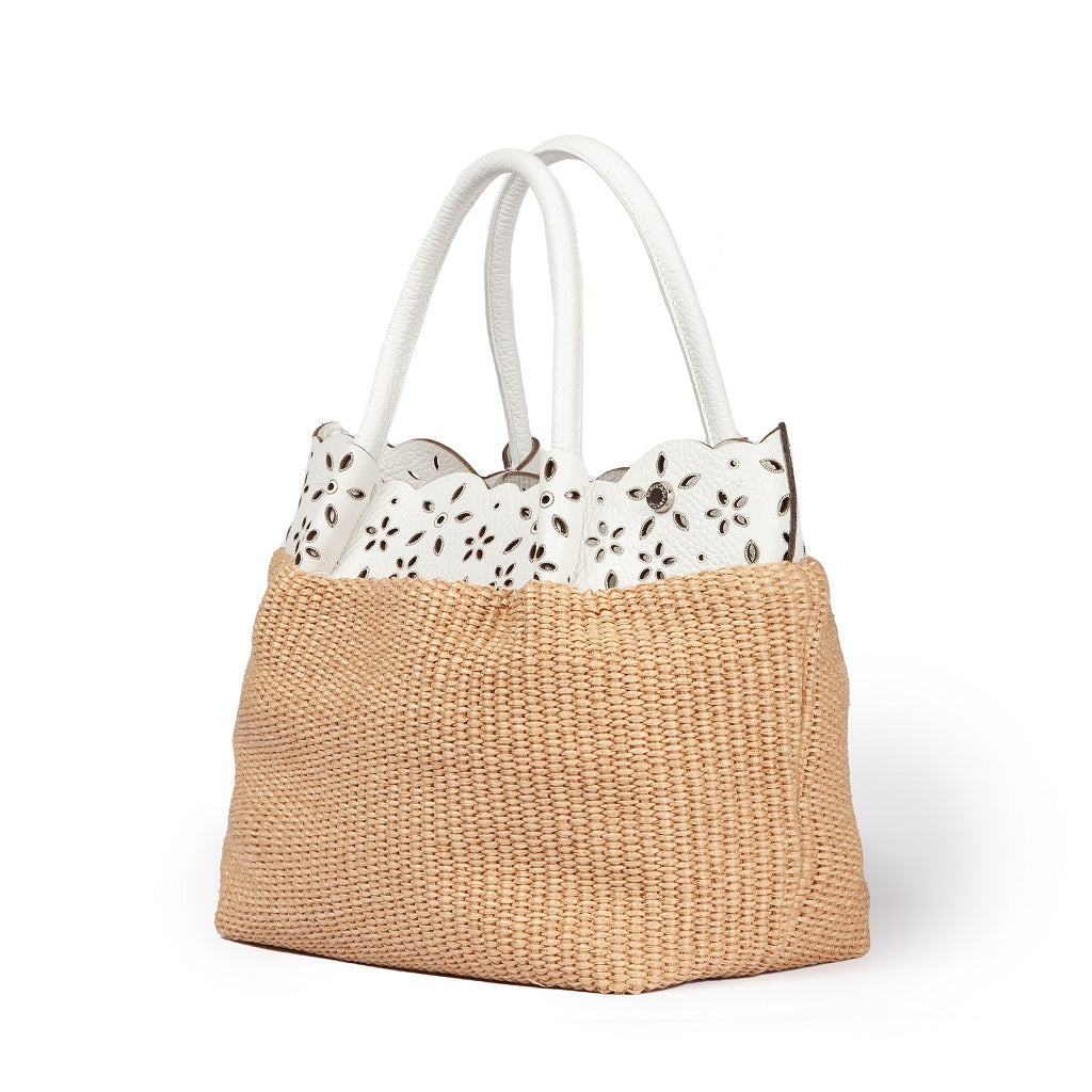 Beige straw tote bag with white floral lace trim and white handles