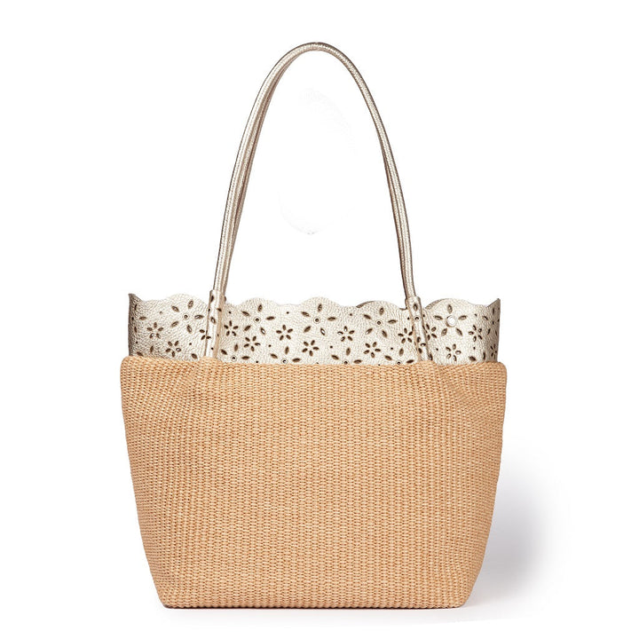 Elegant woven straw tote bag with decorative scalloped leather trim and dual handles