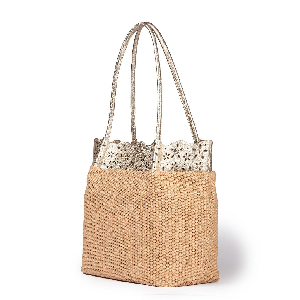 Beige woven tote bag with scalloped white cutout accents and dual handles