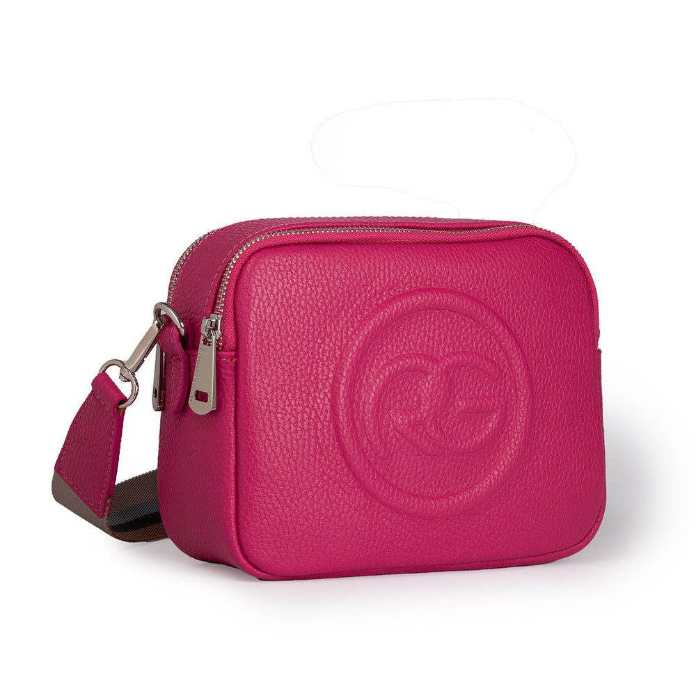 Pink leather crossbody bag with embossed logo and adjustable strap