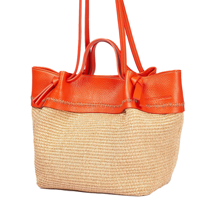 Straw tote bag with orange leather straps and trim