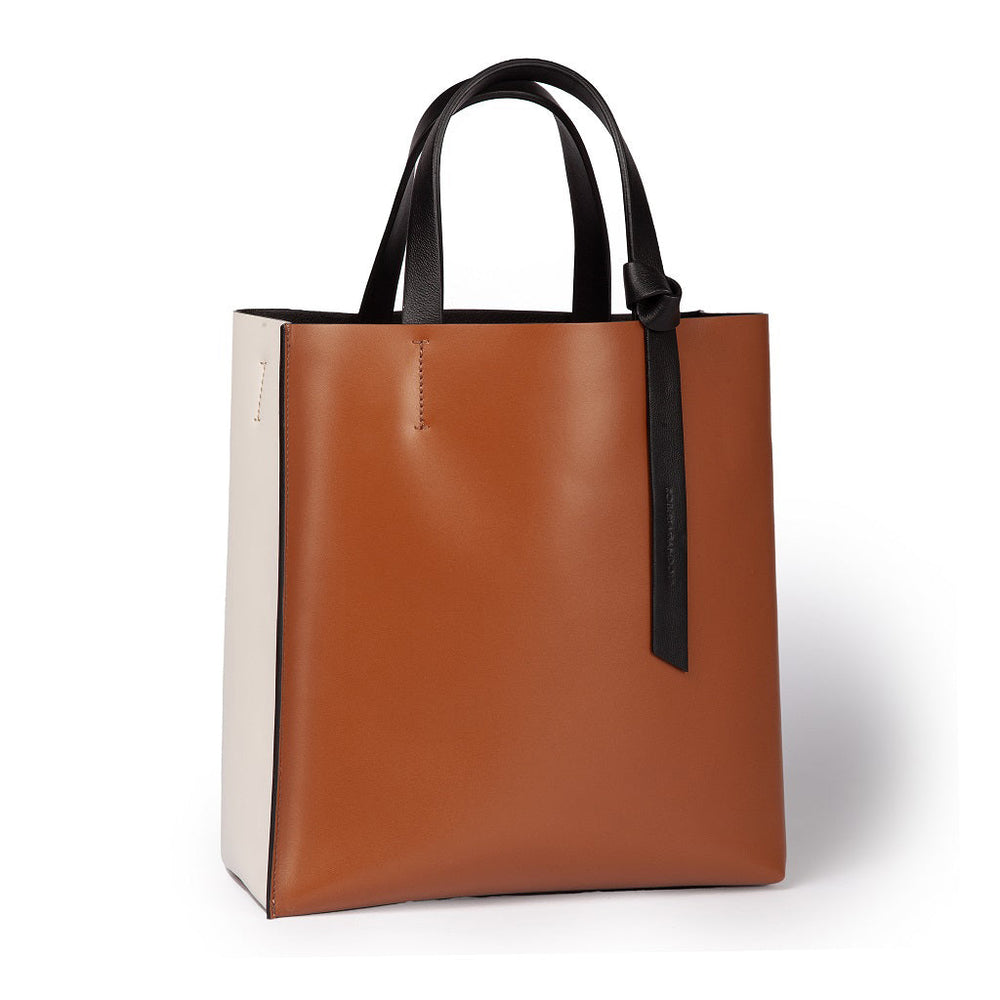 Modern two-tone leather tote bag with black handles