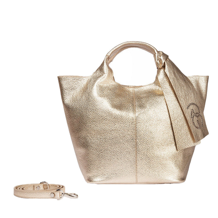 Gold textured handbag with attached bow and detachable shoulder strap