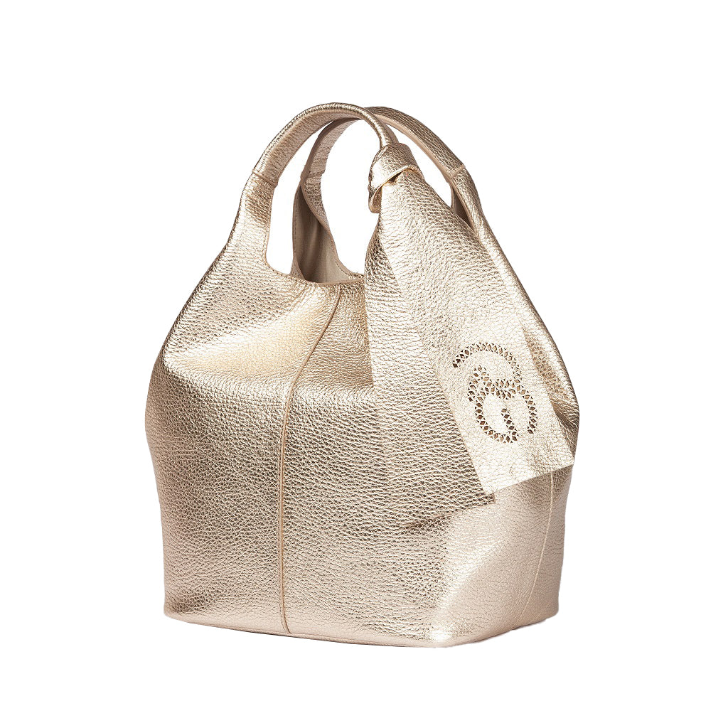 Gold metallic handbag with a soft, textured finish and a knotted handle