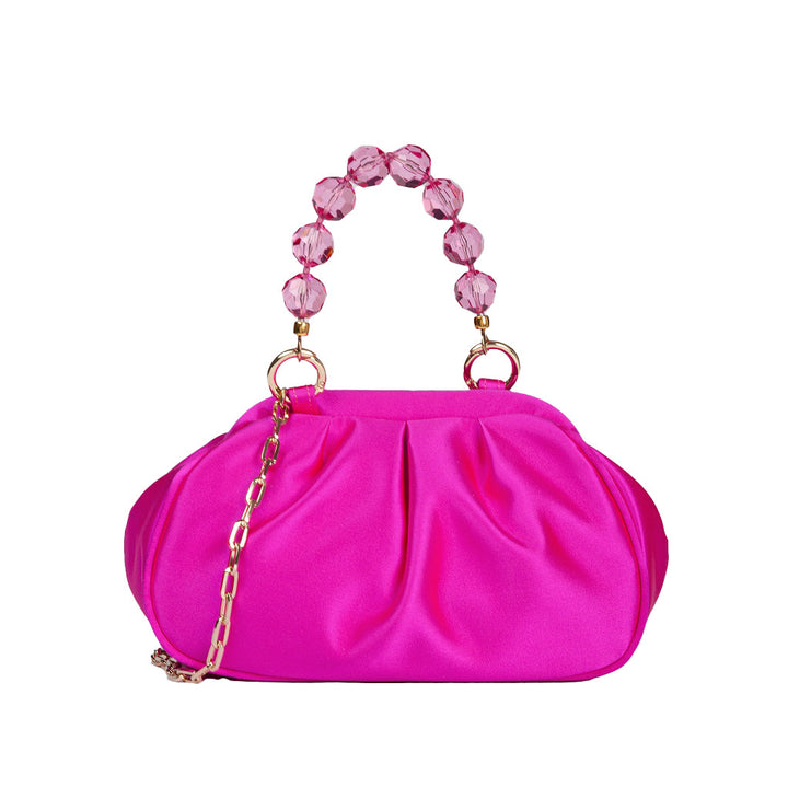 Hot pink satin clutch purse with beaded handle and gold chain strap