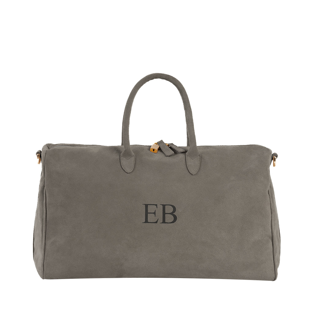 Gray suede weekender bag with monogrammed initials
