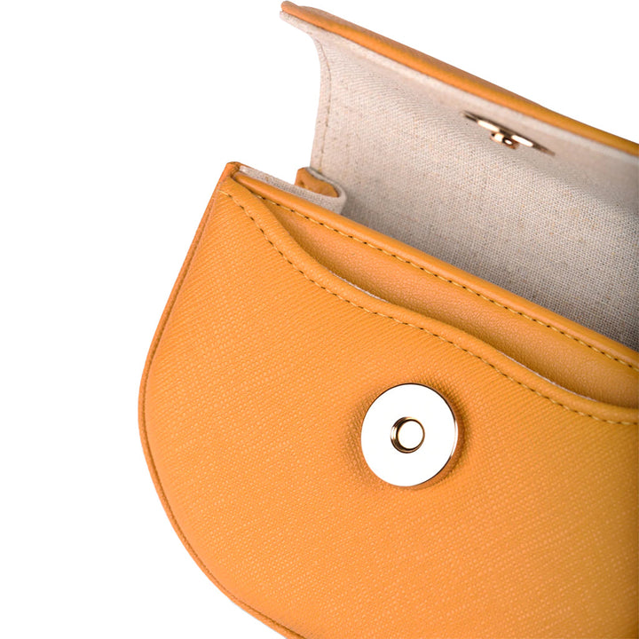 Yellow leather wallet with open button clasp and interior lining