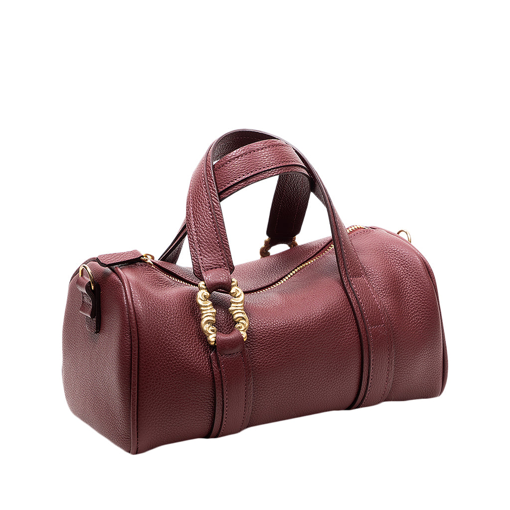 Elegant maroon leather handbag with gold accents