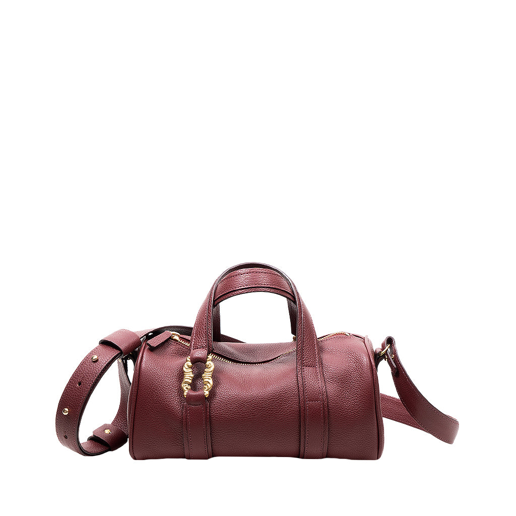 Burgundy leather handbag with gold hardware and adjustable strap