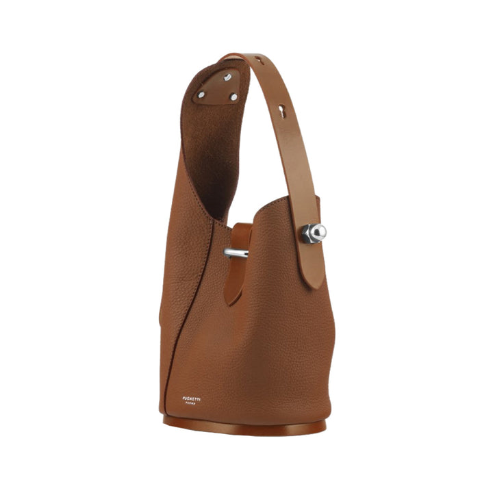 Brown leather bucket bag with silver hardware and adjustable strap