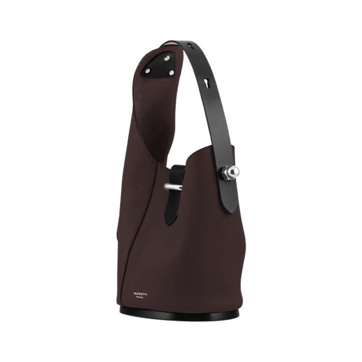 Brown leather bucket bag with black handle and silver hardware
