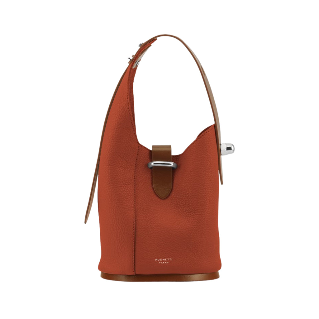 Rust-colored leather bucket bag with silver clasp and adjustable handle