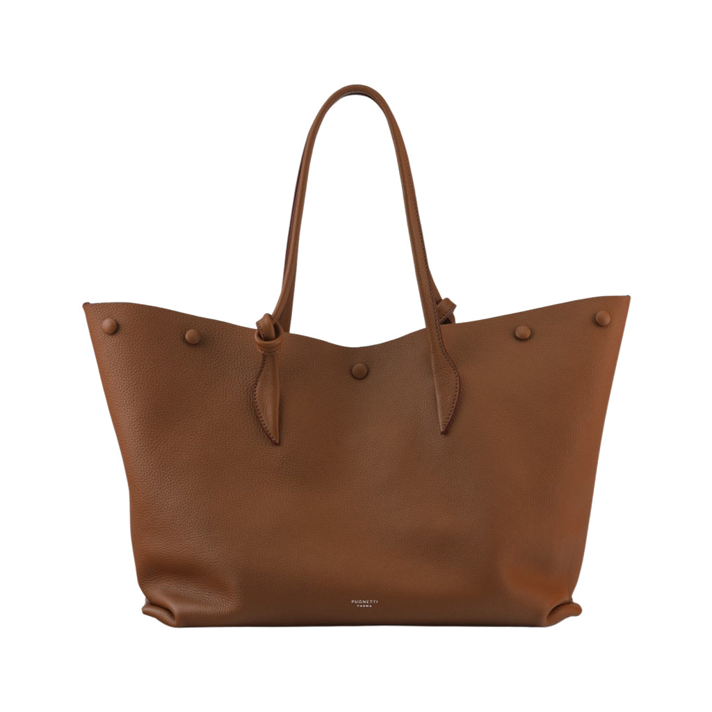 Brown leather tote bag with handles and button accents against a white background