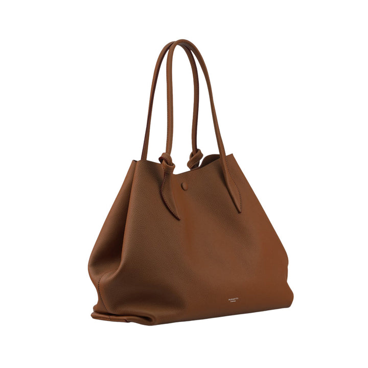 Brown leather tote bag with long handles and minimalistic design