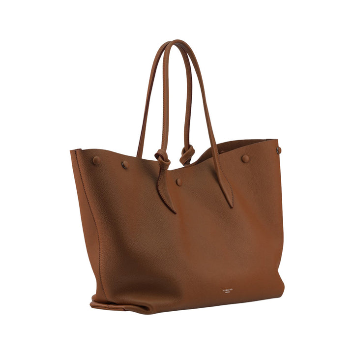 Brown leather tote bag with double handles and minimalist design