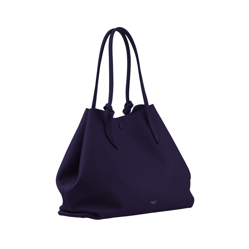 Elegant purple tote bag with long handles and minimalist design