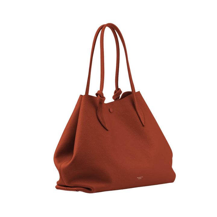 Rust orange leather tote bag with thin handles