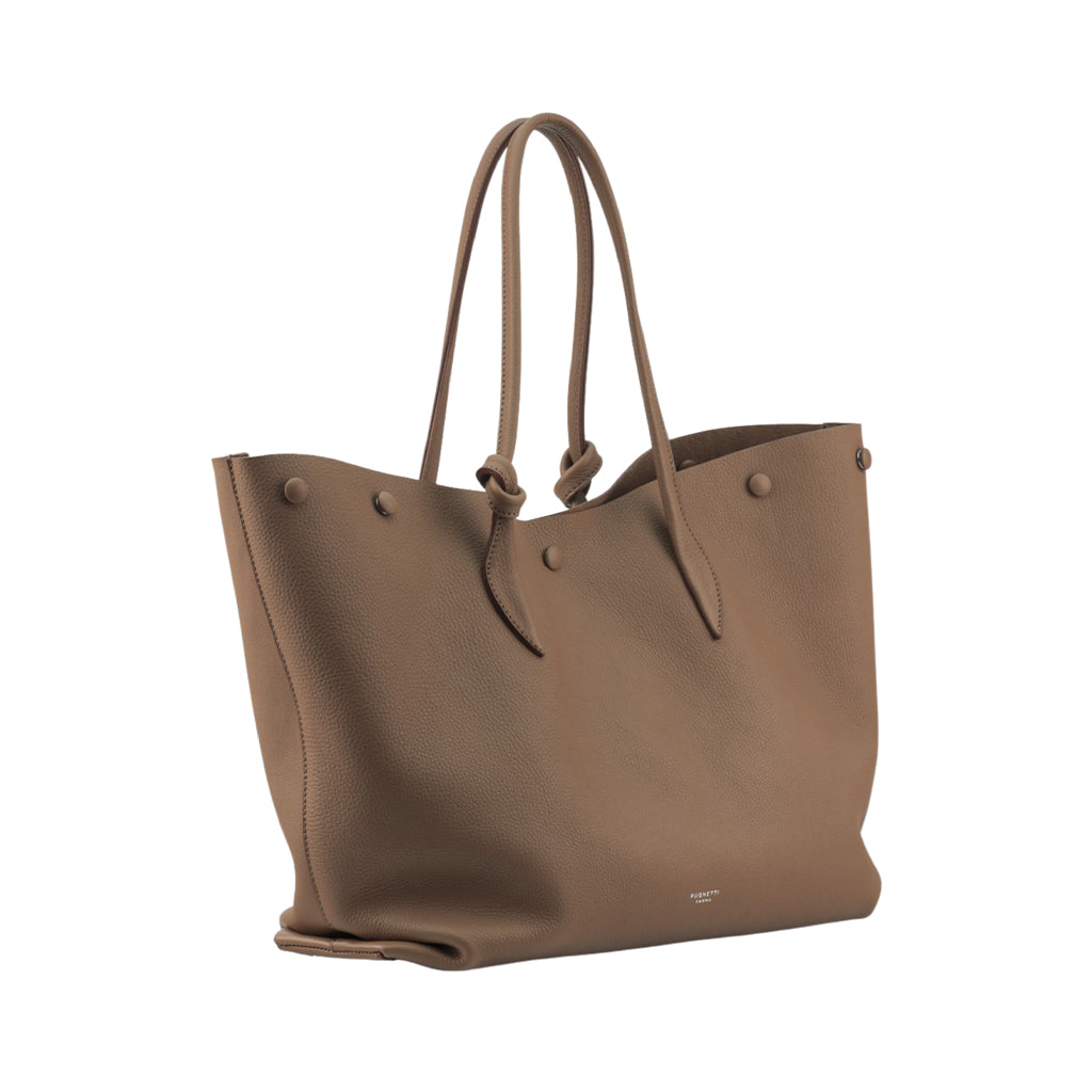 Beige leather tote bag with handles and button accents