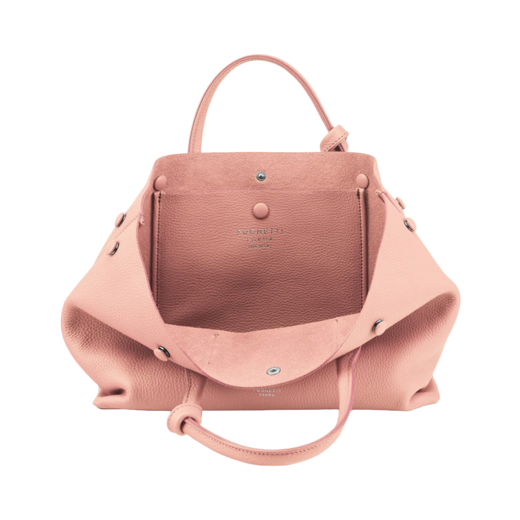 Pink leather handbag with silver hardware and shoulder strap