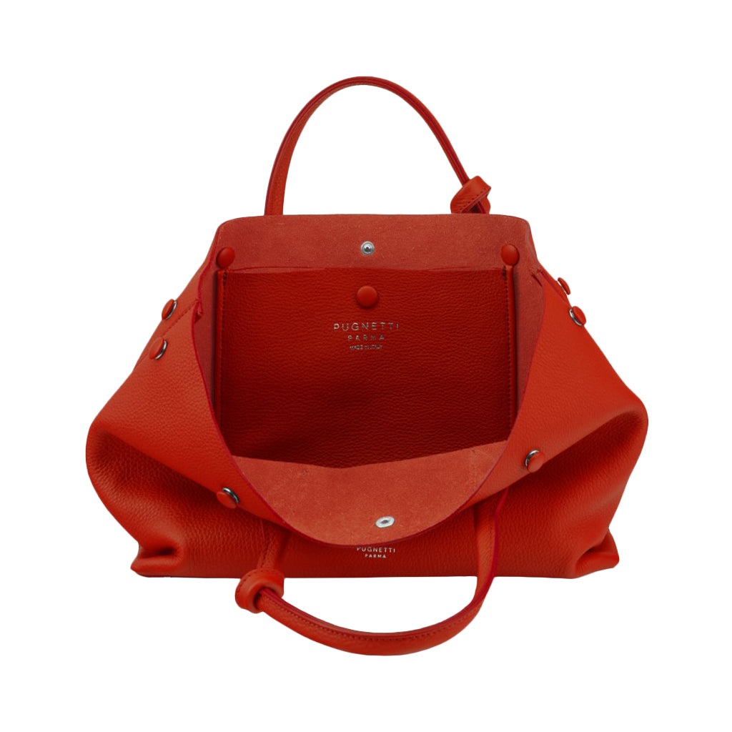 Open red designer handbag with top handle and front pocket