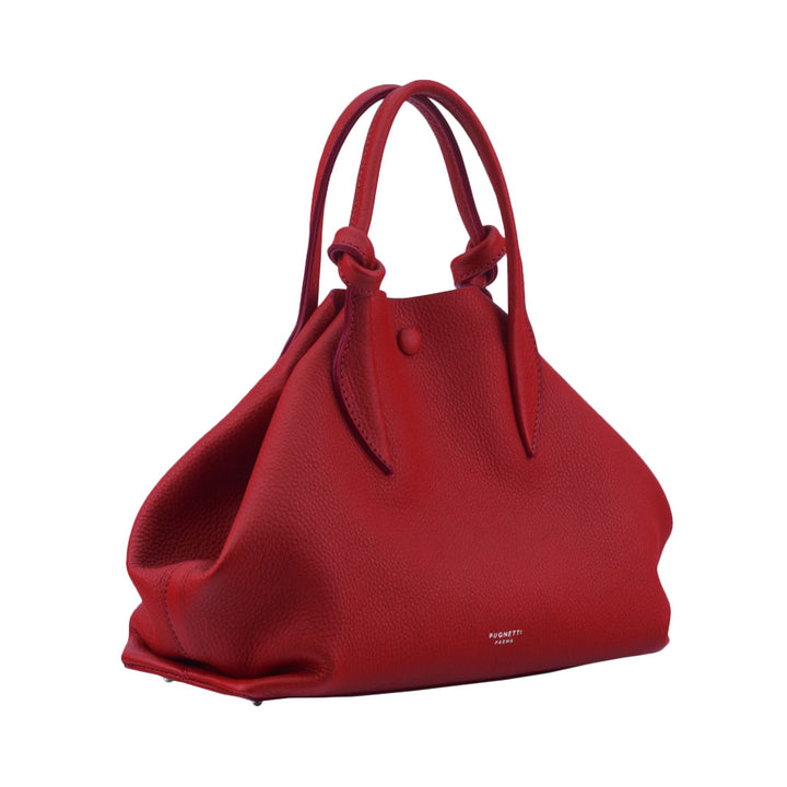 Red leather handbag with dual handles and simple button closure