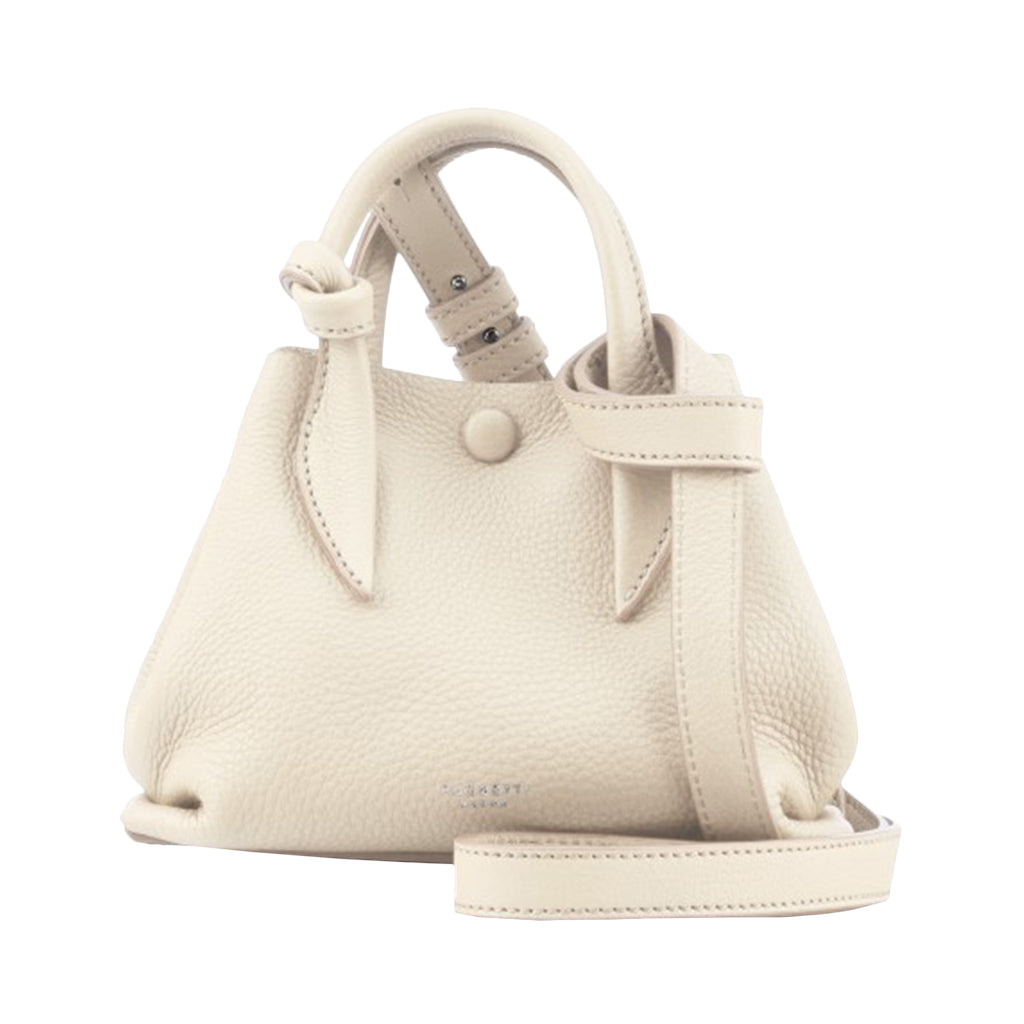 Cream-colored leather handbag with top handles and a shoulder strap