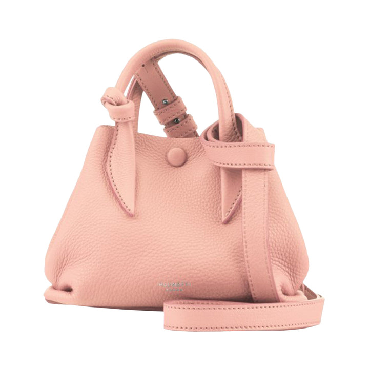 Pink leather handbag with adjustable shoulder strap and button closure