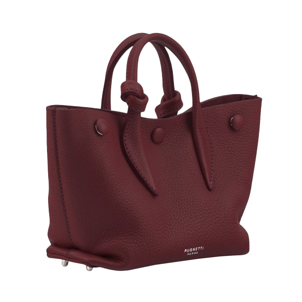 Burgundy leather handbag with top handles and a textured finish