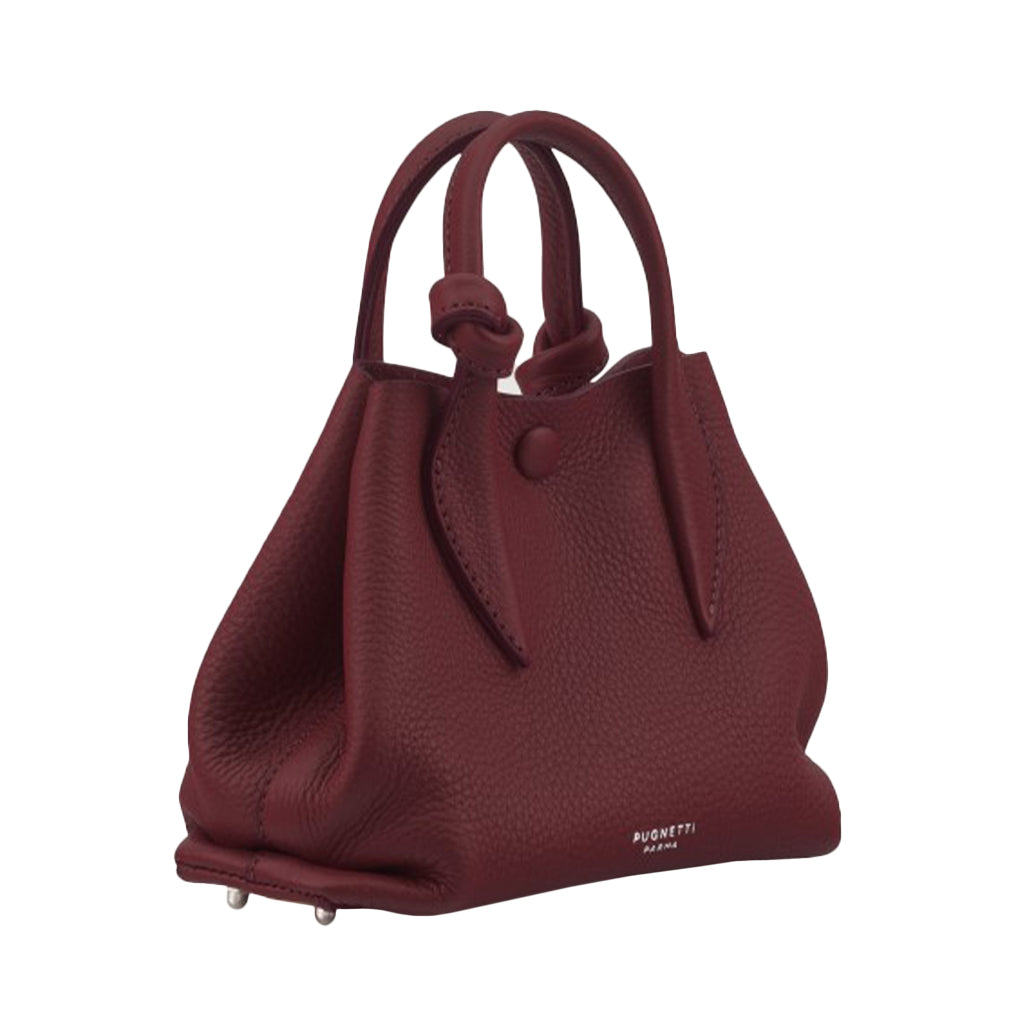 Burgundy leather designer handbag with top handles and subtle logo branding