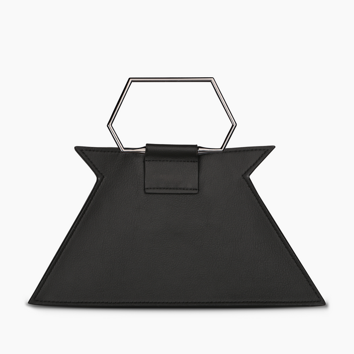 Black geometric leather handbag with hexagonal handle on white background