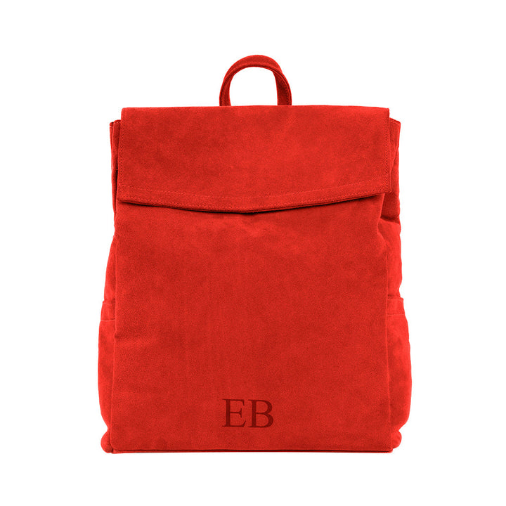 Red suede backpack with front flap and embossed initials EB on the front pocket