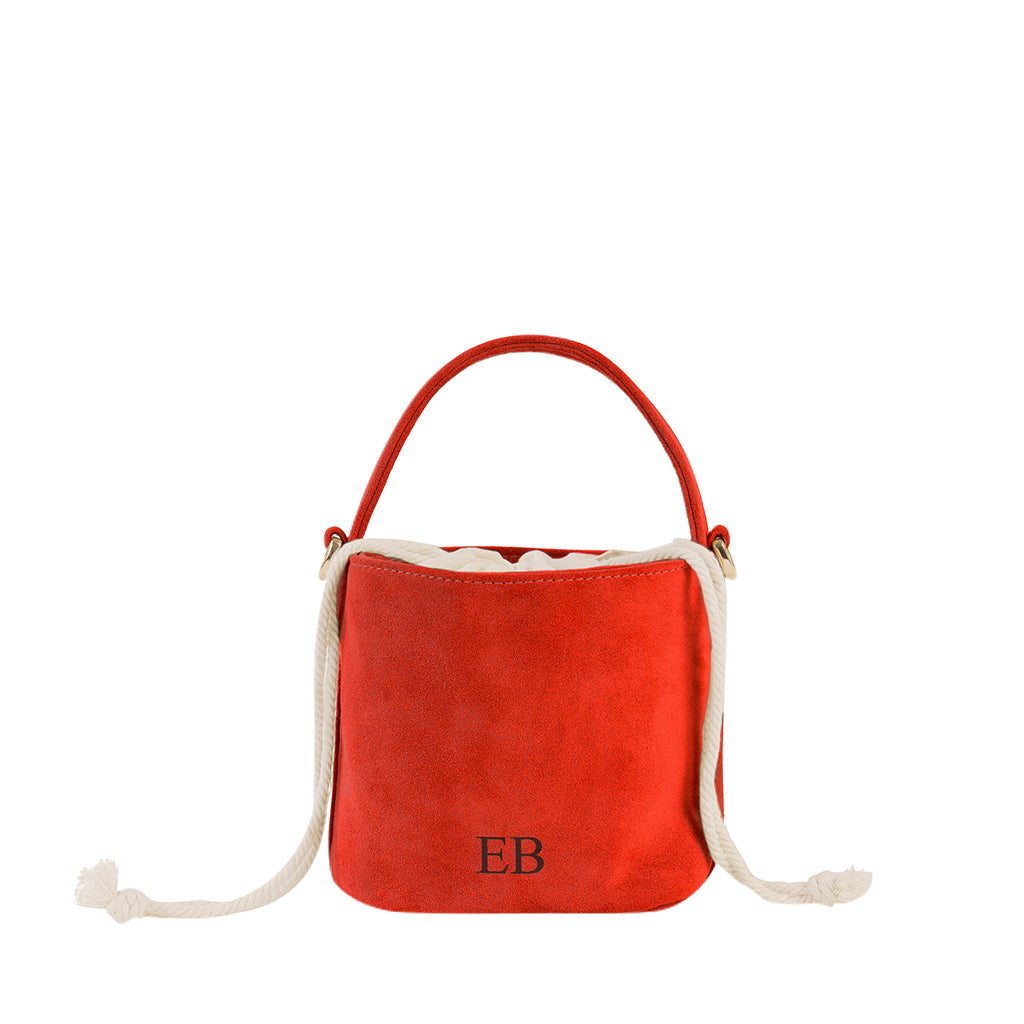 Red suede bucket bag with rope handles and monogram EB