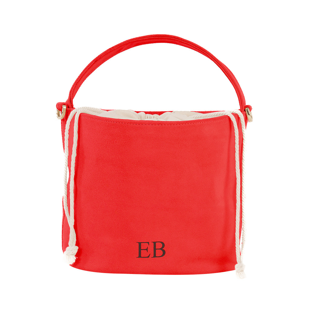 Red bucket bag with monogram initials EB and white drawstring closure