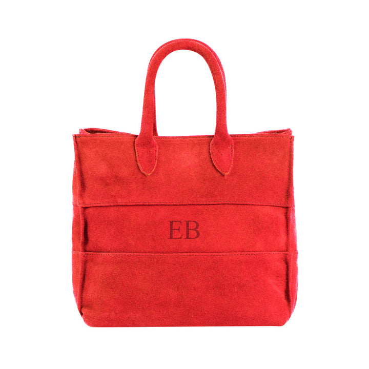 Red suede tote bag with initials EB embroidered on the front